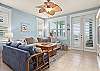 Spacious living room with windows facing the bay 