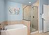 Soak tub and walk in shower in the primary 
