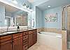 Primary bathroom with double sink vanity 