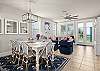 Beautiful open floor dining room and living room with large windows facing the gulf 