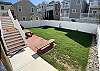 Rear Yard picnic table next to BBQ and stairway to the house 