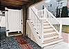 outside shower located on the ground floor next to stairway to the house. 