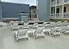 Plenty of lounge chairs and tables around the pool to enjoy