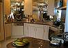 Kitchen is compact yet functional with high end appliance package.