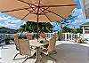 Large front lanai has views of the mountains and ocean.