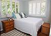 Main guest room is spacious and bright.
