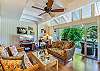 Spacious living room with lanai garden views