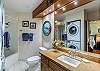 Master bedroom ensuite bathroom with washer & dryer