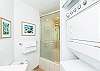 Full bathroom with washer dryer