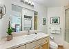 Full bathroom with washer dryer