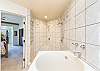 Master bedroom en-suite bathroom with walk in shower and Japanese soaking tub
