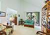 Upstairs sitting area with tv and a lanai