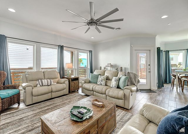 Spacious living room with ceiling fan 
