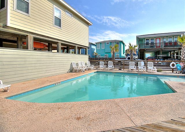 Community pool with poolside seating