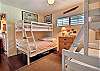 Relax in the bedroom with two twins over full bunk beds. 