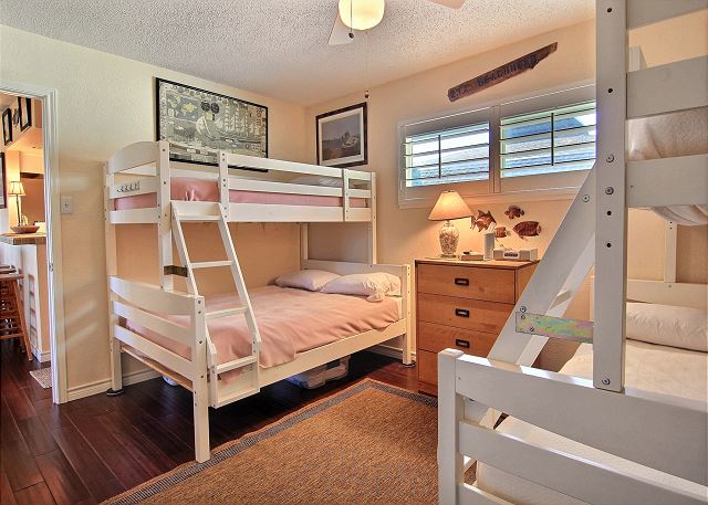 Second bedroom with two twin over full bunk beds. 