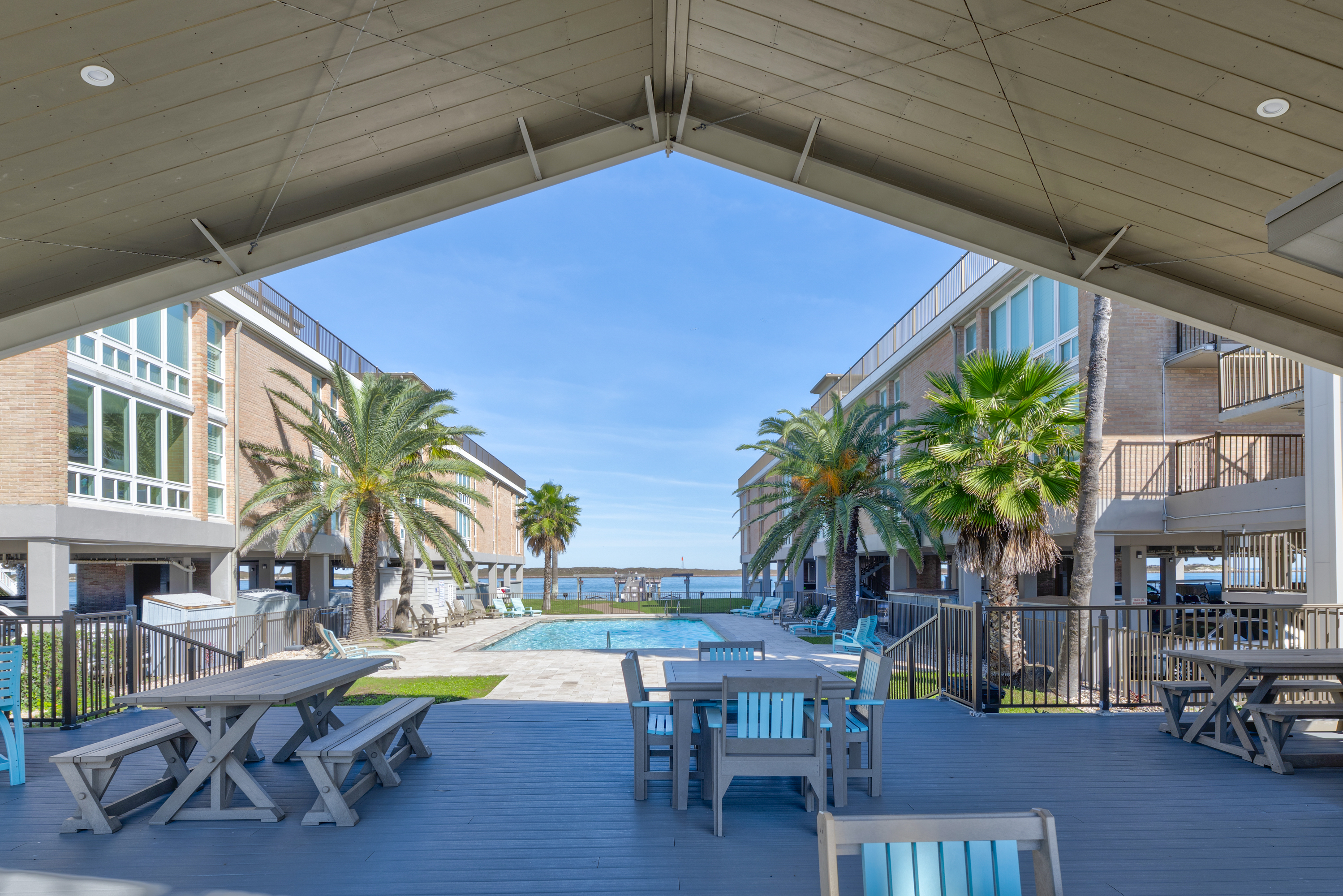 Poolside Perks: Shaded Patio, Seating and a Restroom just steps away! 