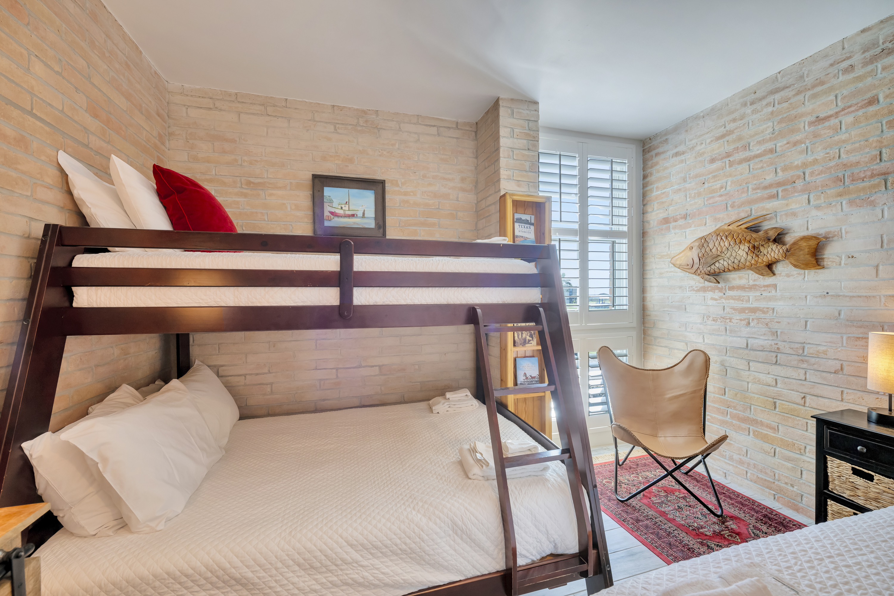 Twin-over-full bunks provide flexible sleeping options in this cozy king bedroom.