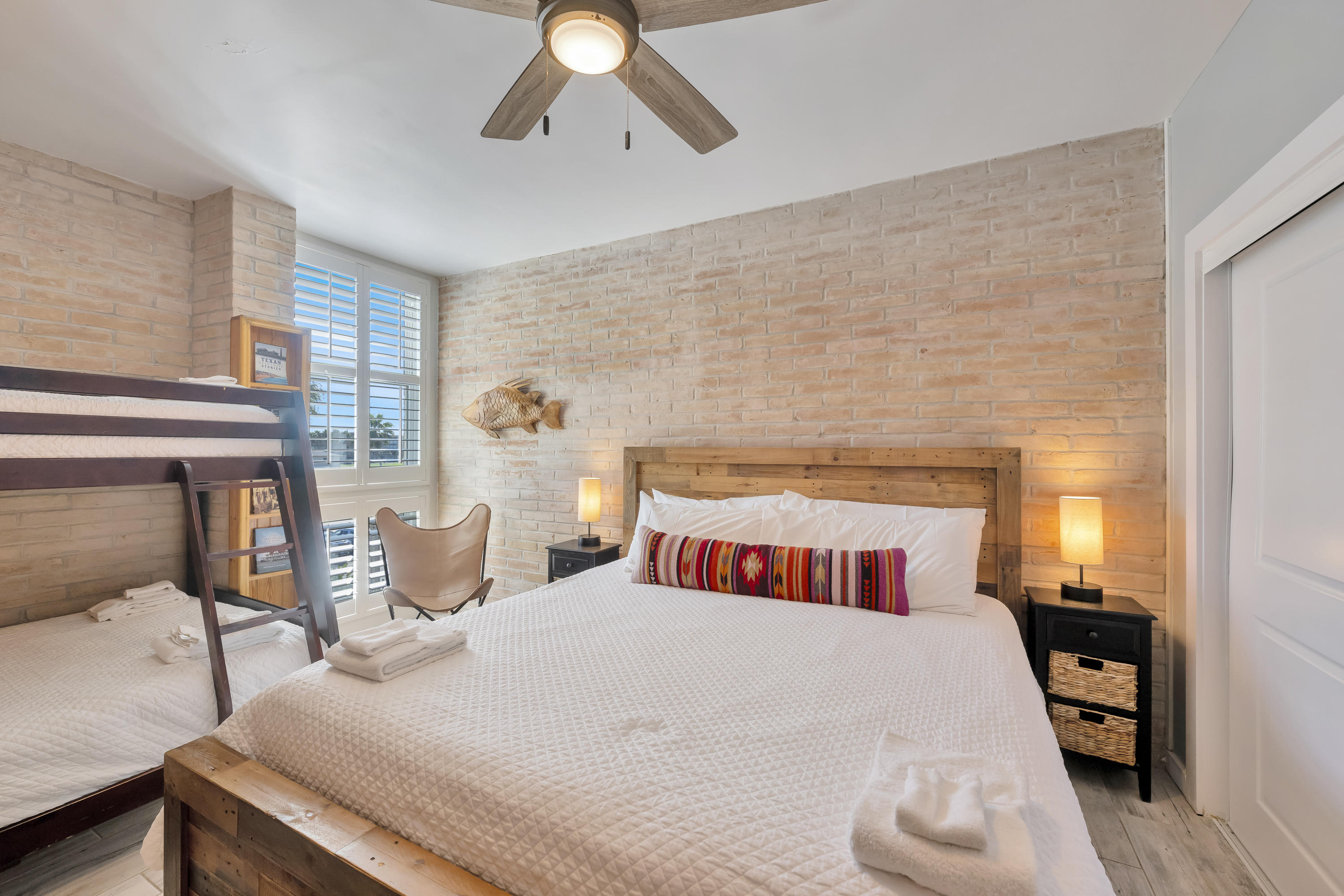 Twin-over-full bunks make this cozy king bedroom perfect for families and flexible sleeping needs.