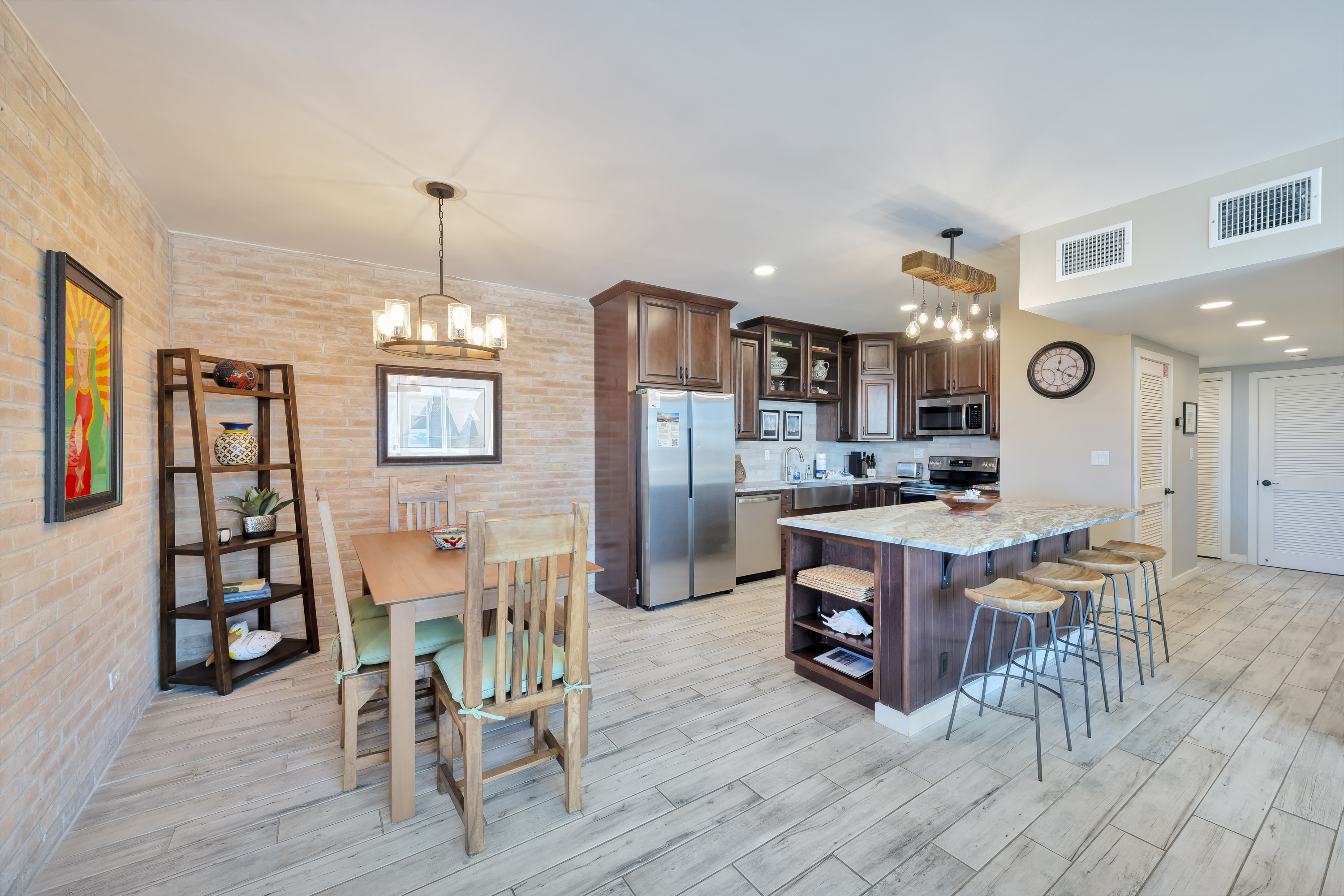 Open-concept layout connecting the kitchen to dining area to the living room