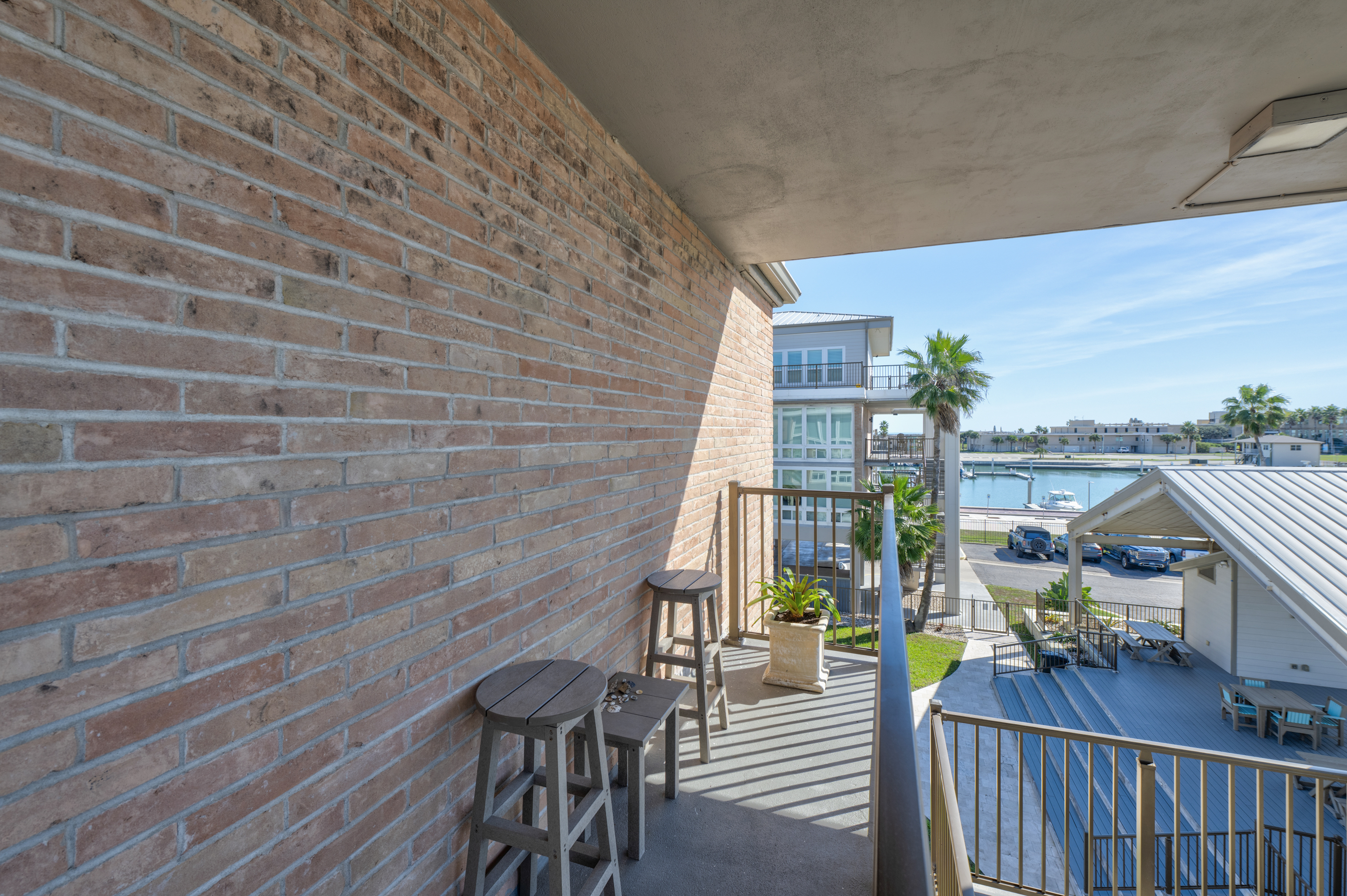 Enjoy the coastal breeze from the outdoor sitting area just outside the unit entrance.
