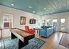 Where style meets play! A Great Room with Shuffleboard Flair! 