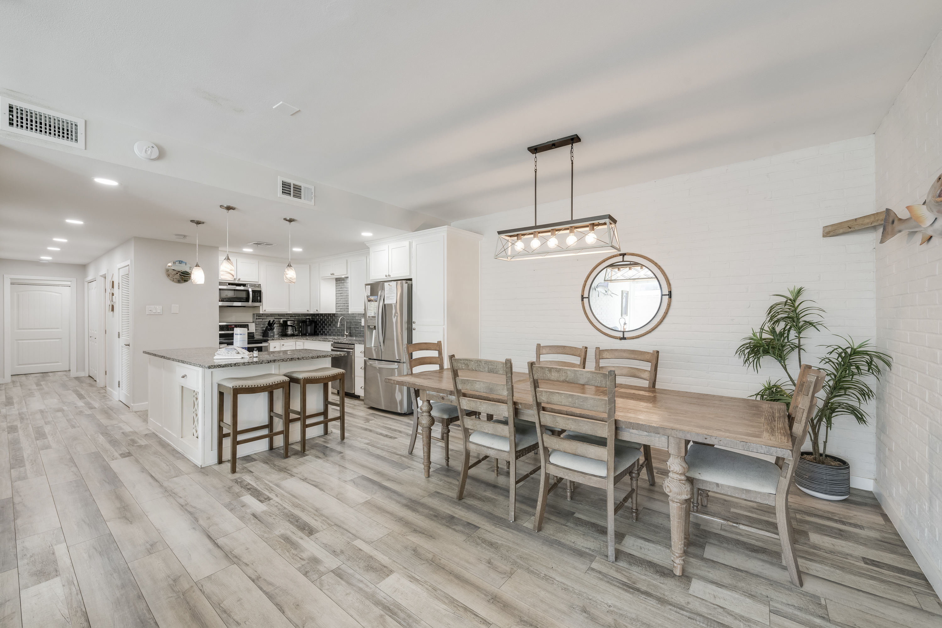 Bright and airy dining area seamlessly connected to the kitchen, creating a welcoming open-concept layout.