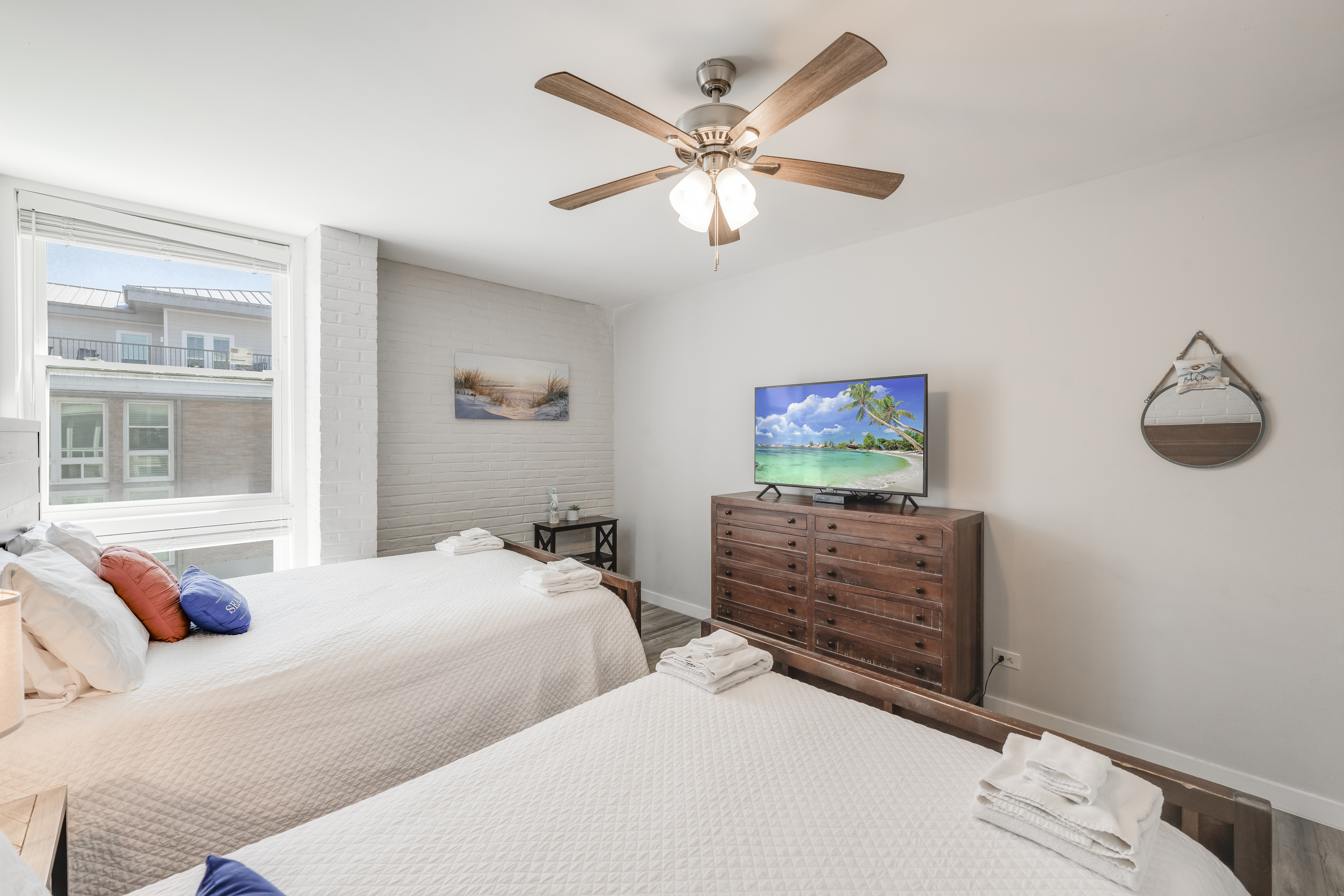 Plenty of room to relax and unwind in this bedroom featuring 2 queen beds and a flat screen TV