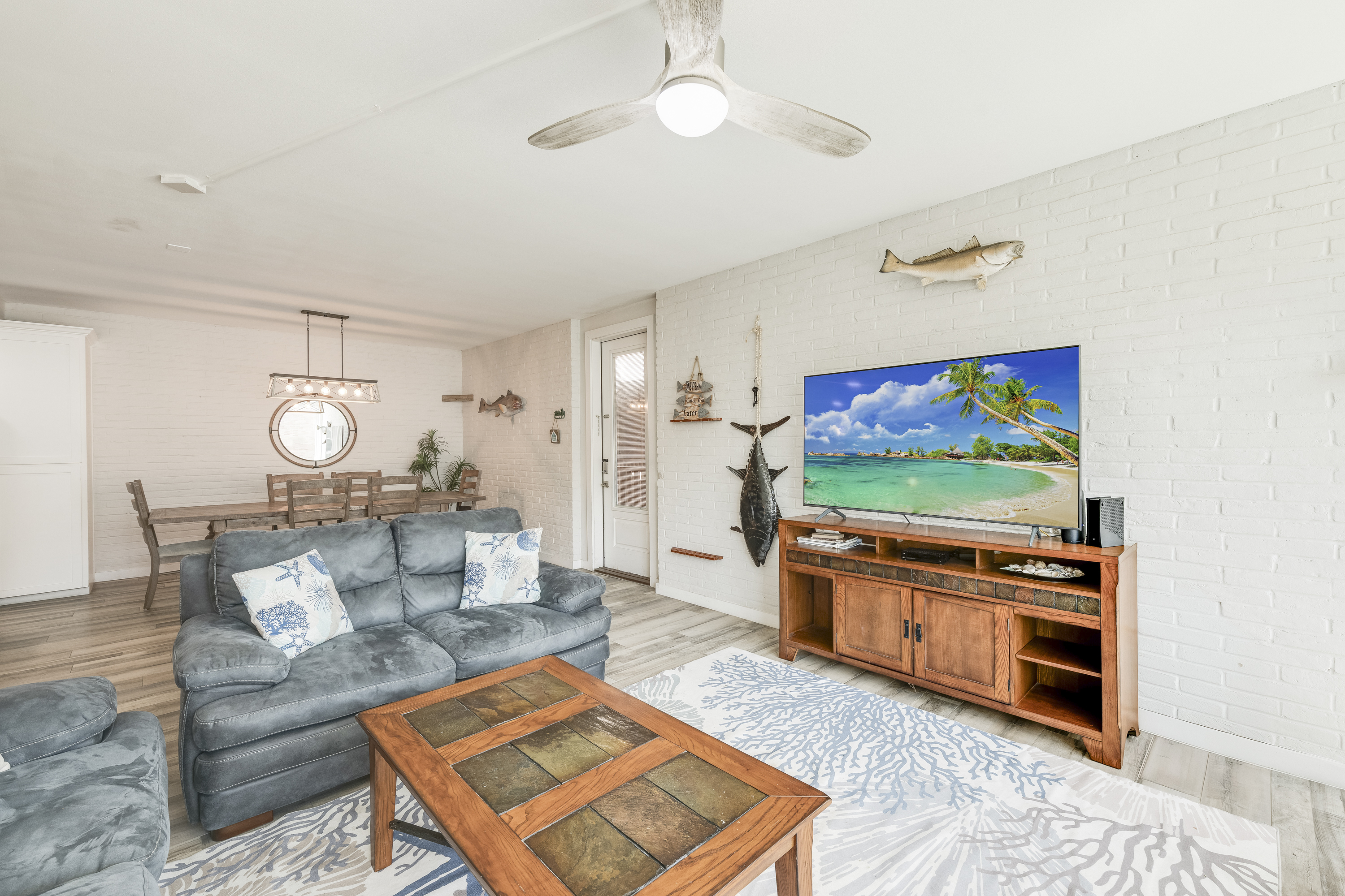 Relaxing, comfortable living area with a large flat screen Tv