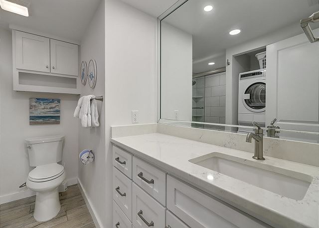 Guest bathroom with washer dryer