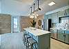 Fully-equipped kitchen with a breakfast bar or prep island