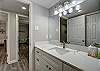 Stylish bathroom boasting a sleek toilet, contemporary sink and counter