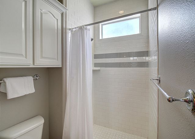 Bathroom with stand-up shower.