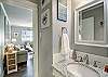 Stylish bathroom boasting a sleek toilet and contemporary sink with ample counter space 