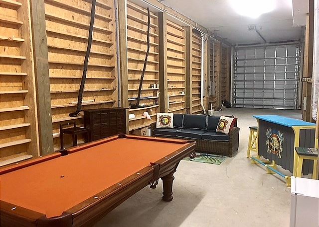Game room with couch and mini bar