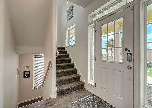 Foyer with access to stairways