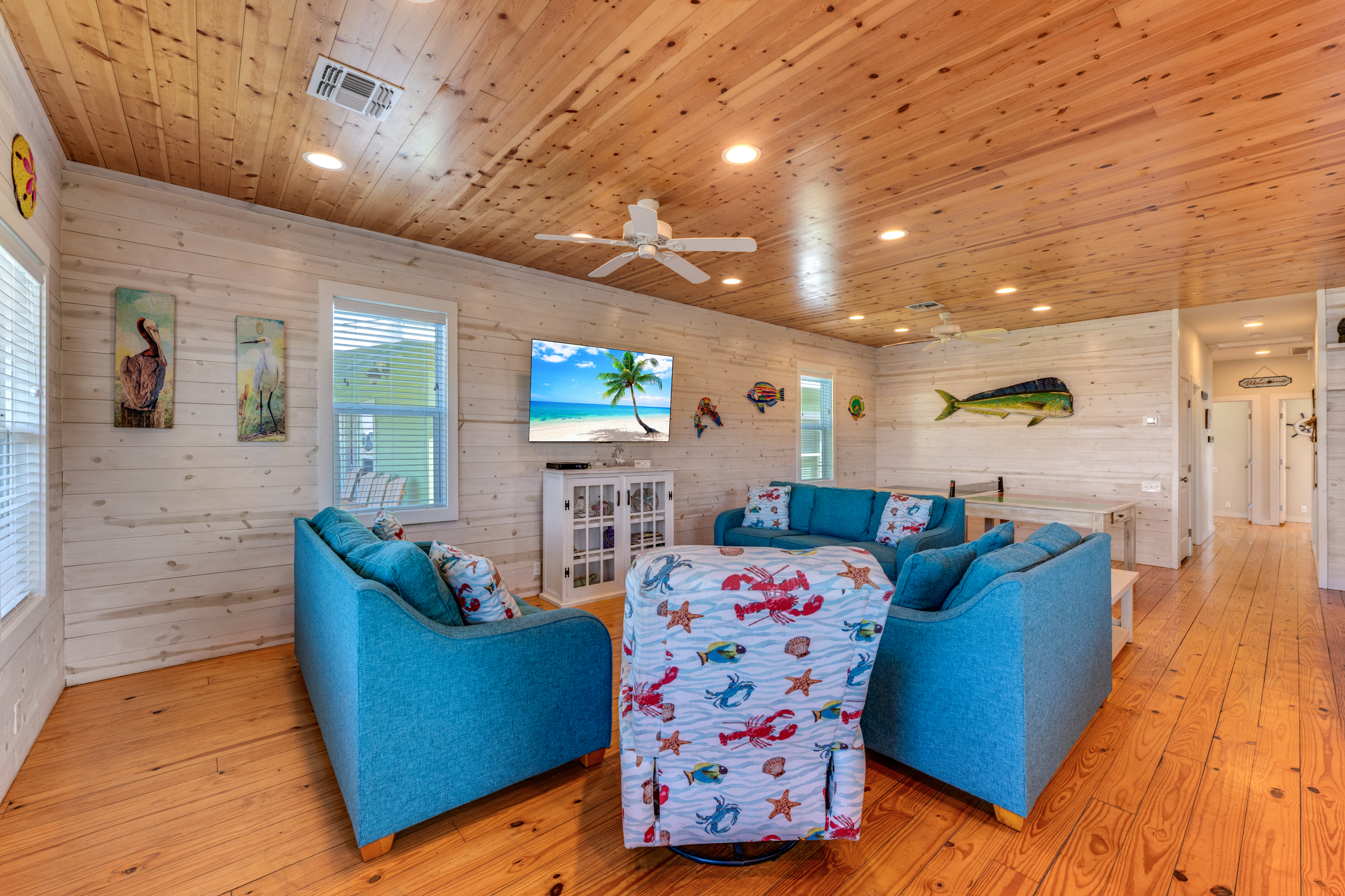 Bright open-concept living area designed for family gatherings and island comfort