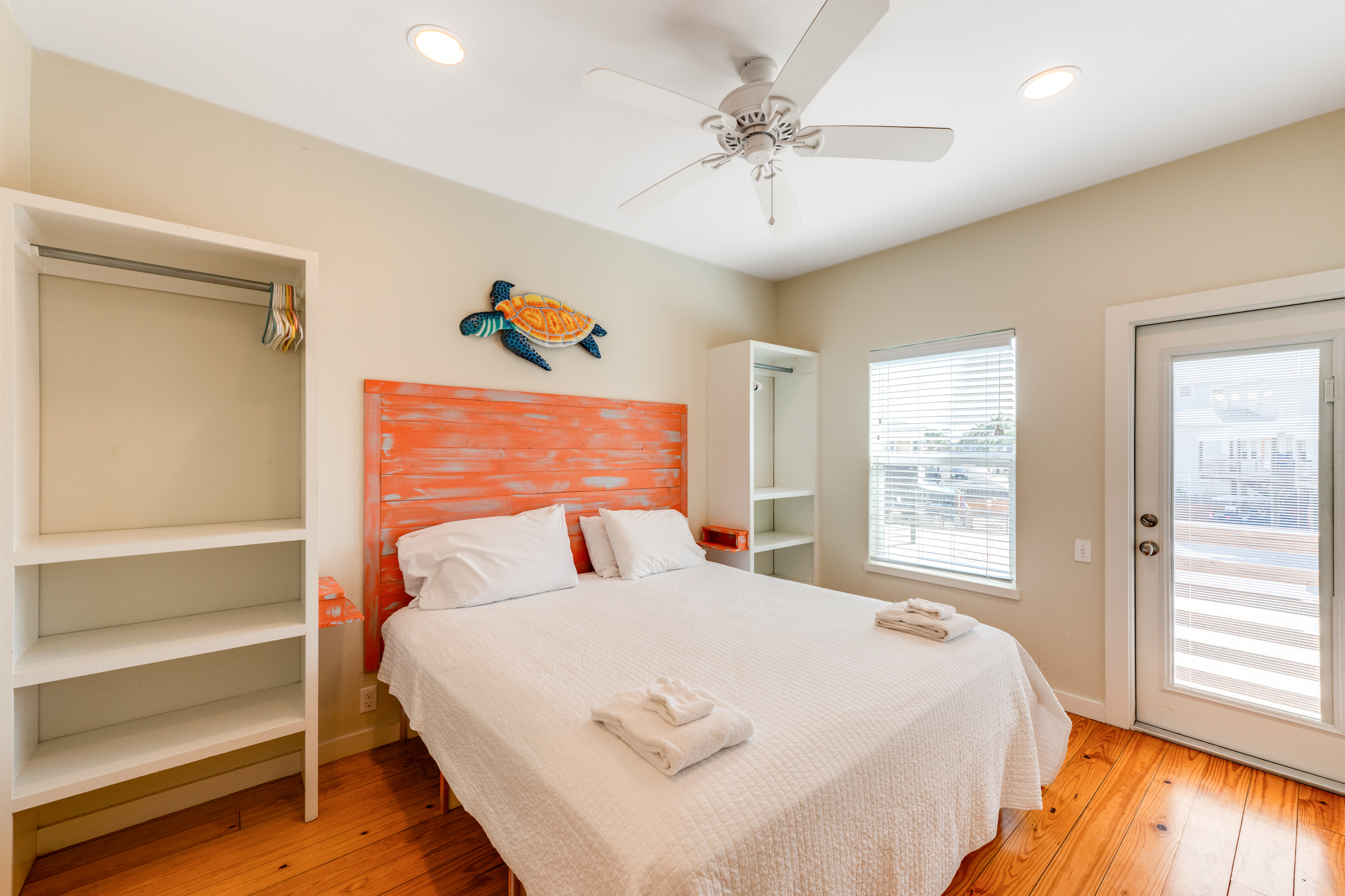 King bed and ensuite bath with front upper deck access from bedroom