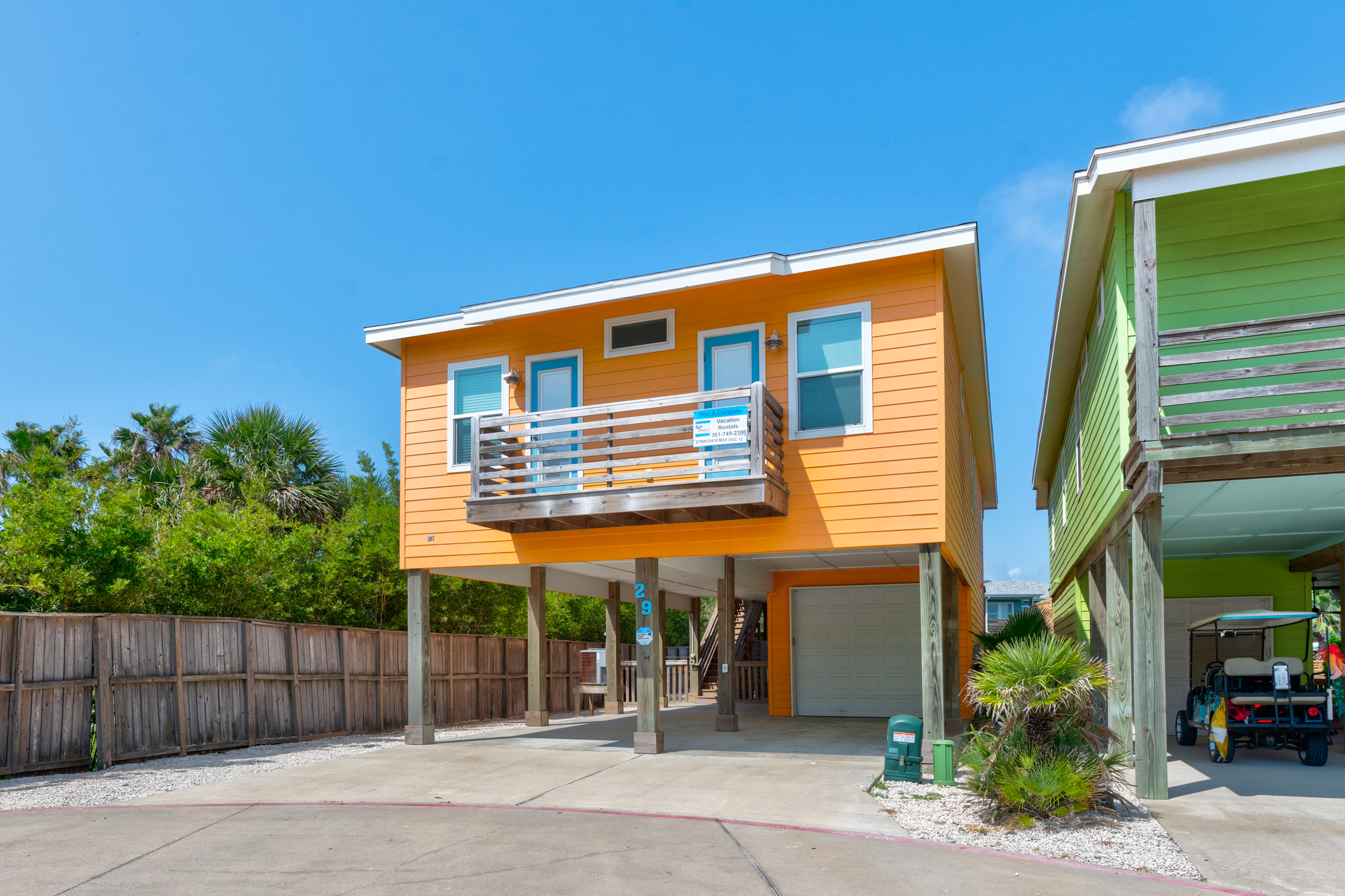 Entrance to Orange You Glad To Be Here with covered parking