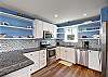 Kitchen with plenty of counter space and a standard drip coffee pot