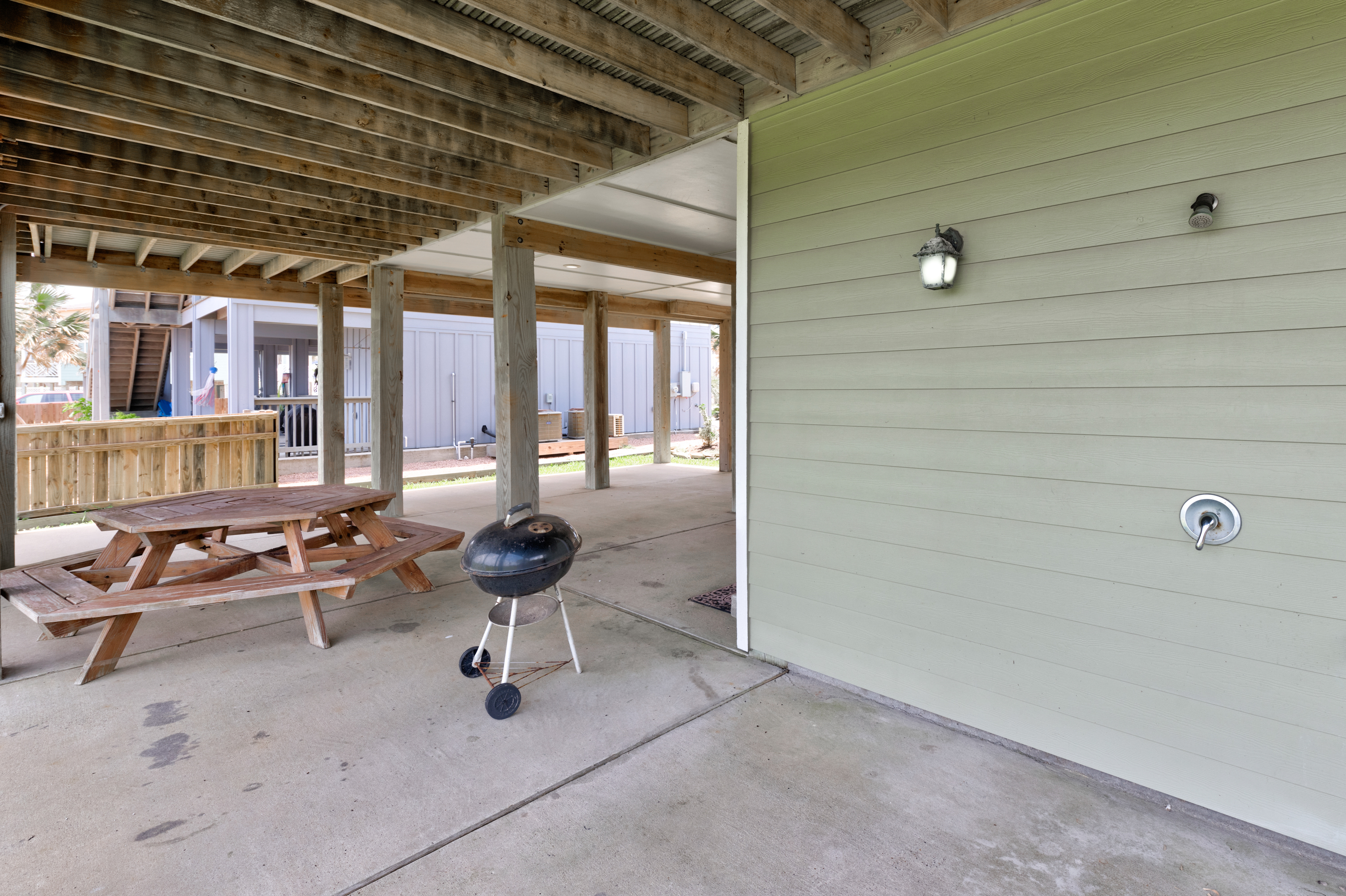 Fire up the grill and enjoy outdoor dining in this spacious cookout area! Perfect for family barbecues or a relaxed evening under the coastal sky.