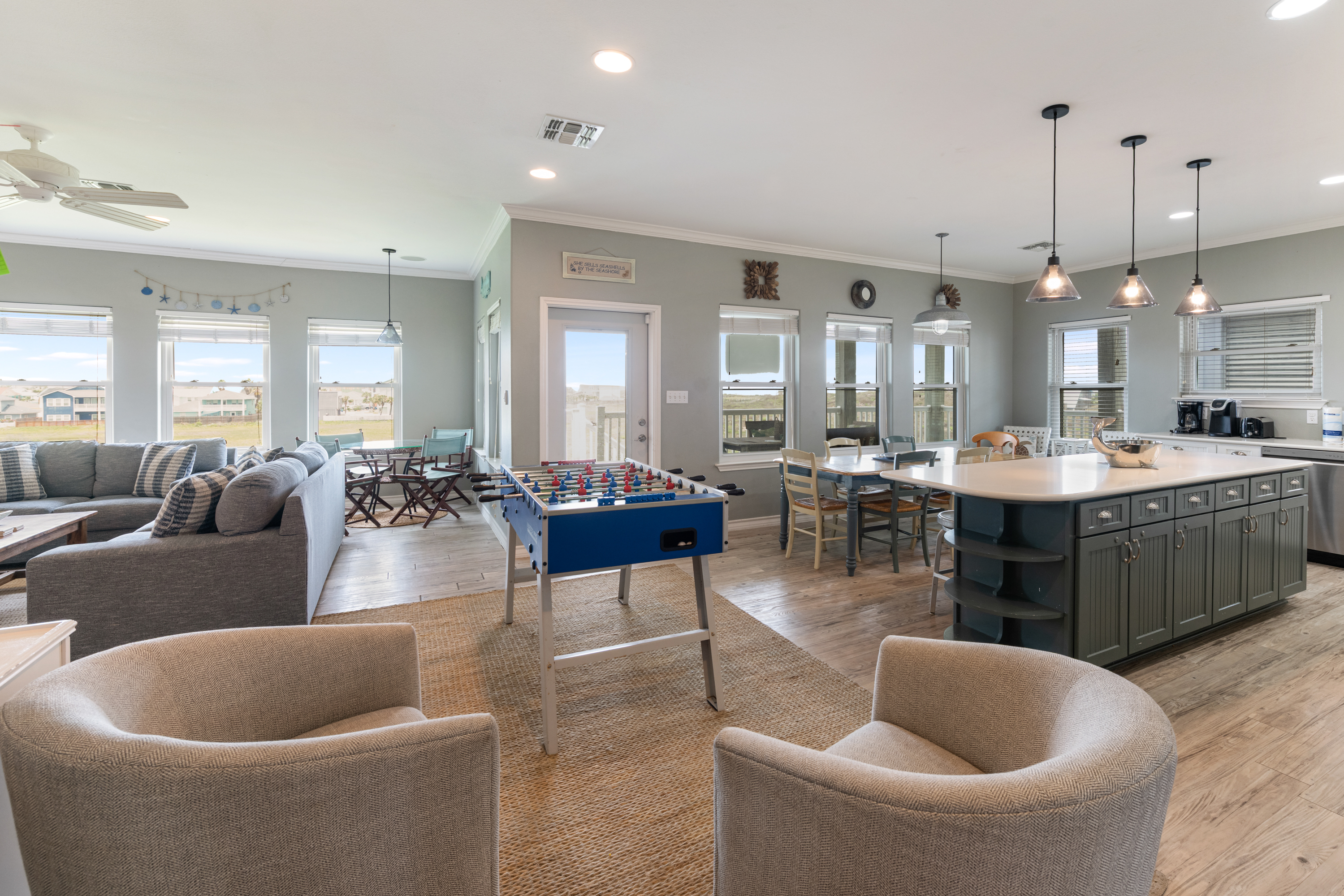 Soft, comfortable seating, and ocean-inspired details create a welcoming space perfect for unwinding after a day by the shore.