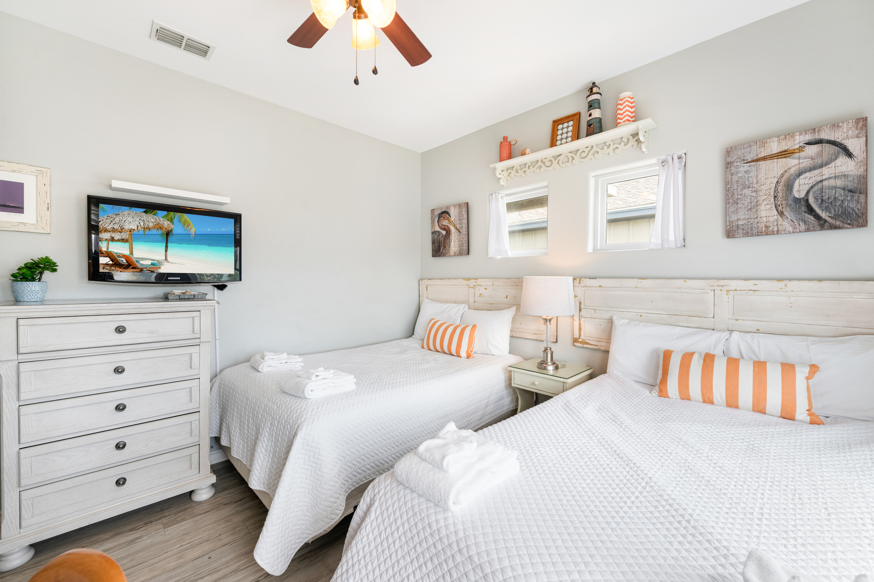Room to stretch out and unwind with two full beds and mounted TV