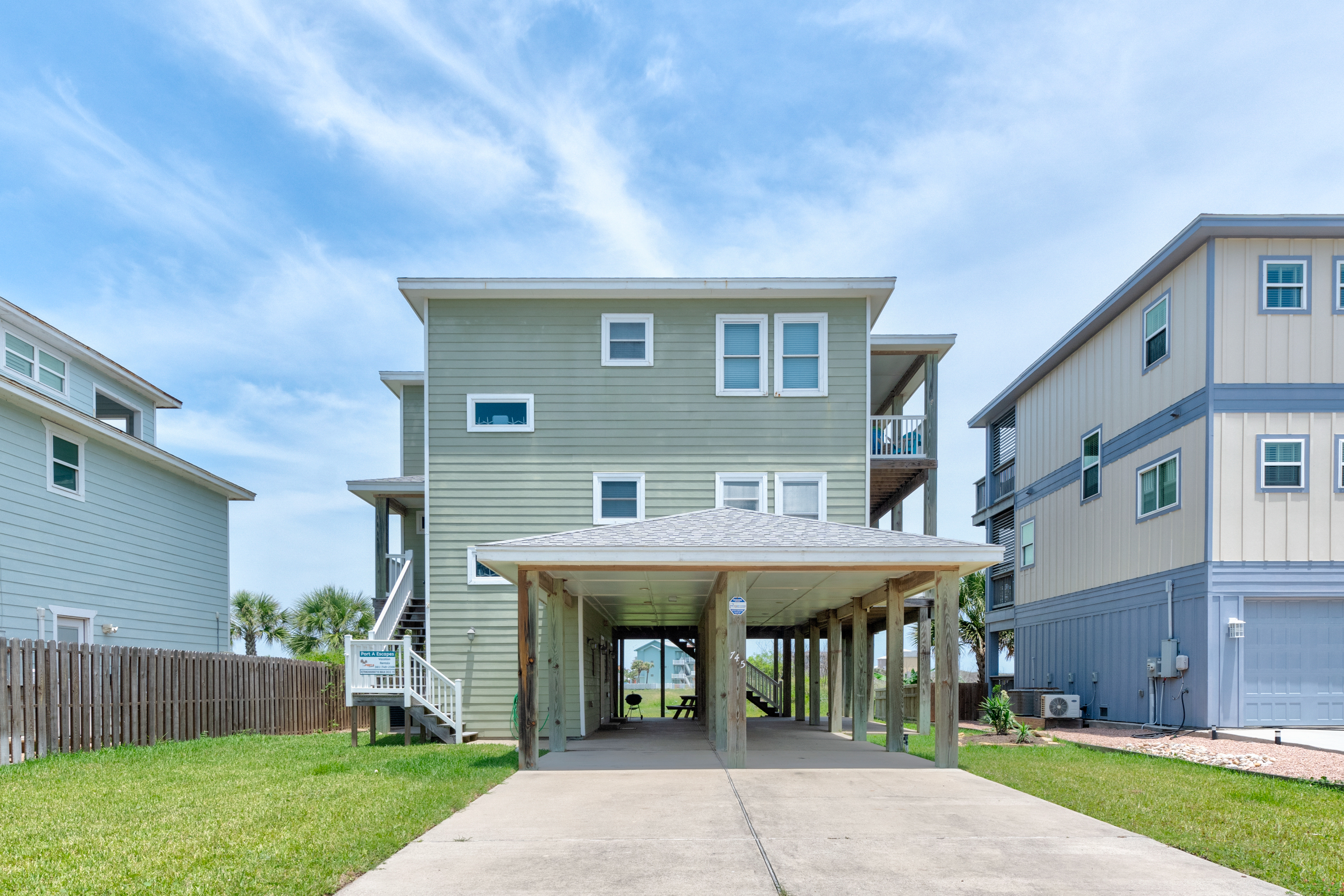 Exterior stairs conveniently connect to second level patio/deck