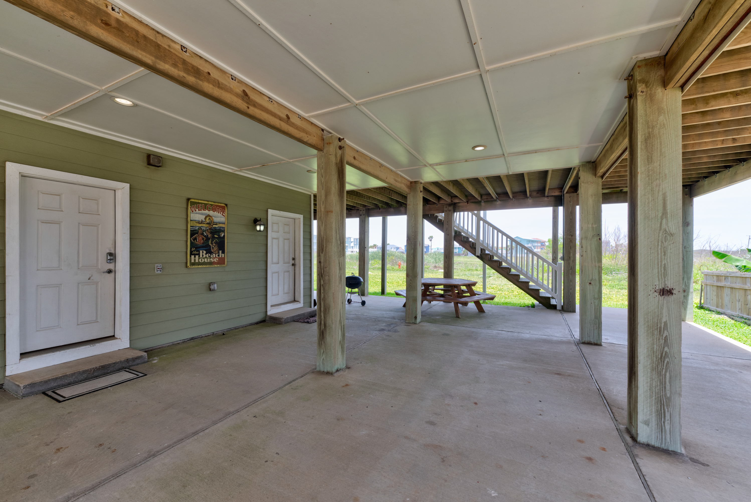 Coastal comfort awaits: furnished patio for lounging and dining.