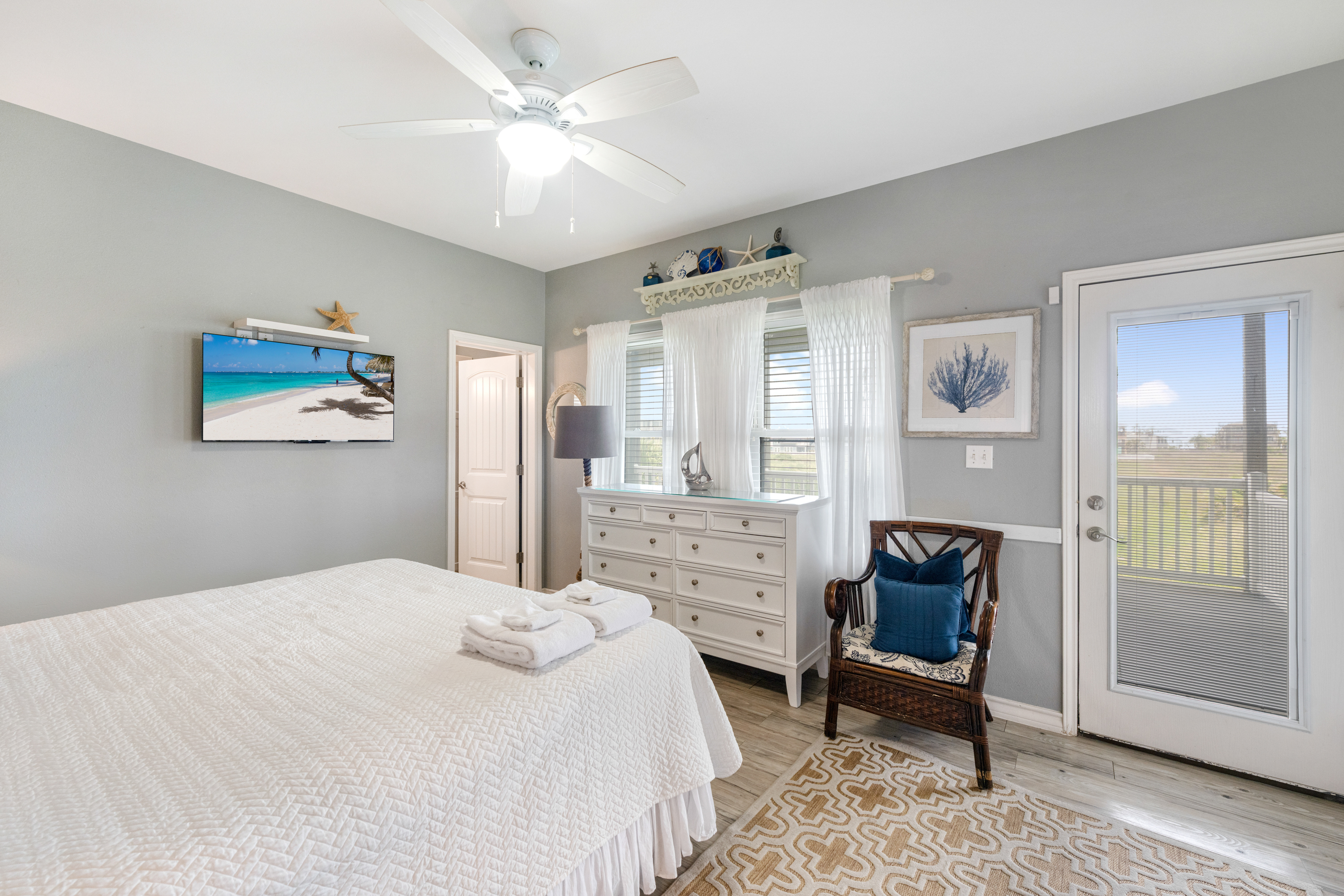 Serene King Haven with Patio Doors Leading to Refreshing Coastal Air