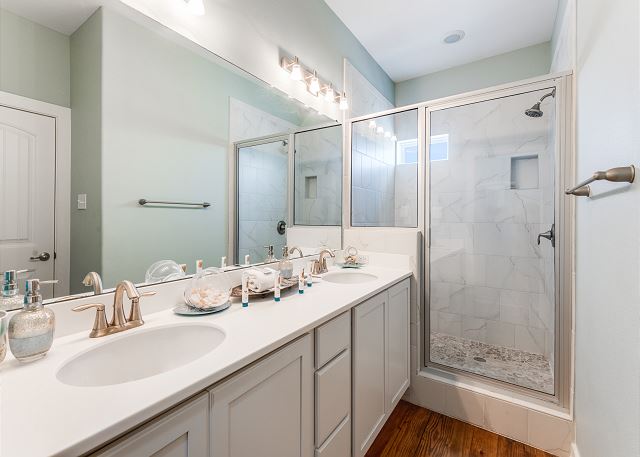 Bathroom with double vanity and walk-in shower