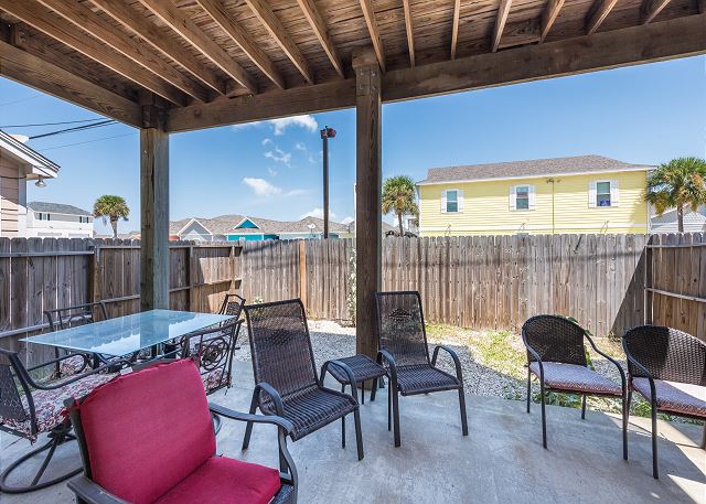Seating and table outdoors to catch that Gulf breeze!