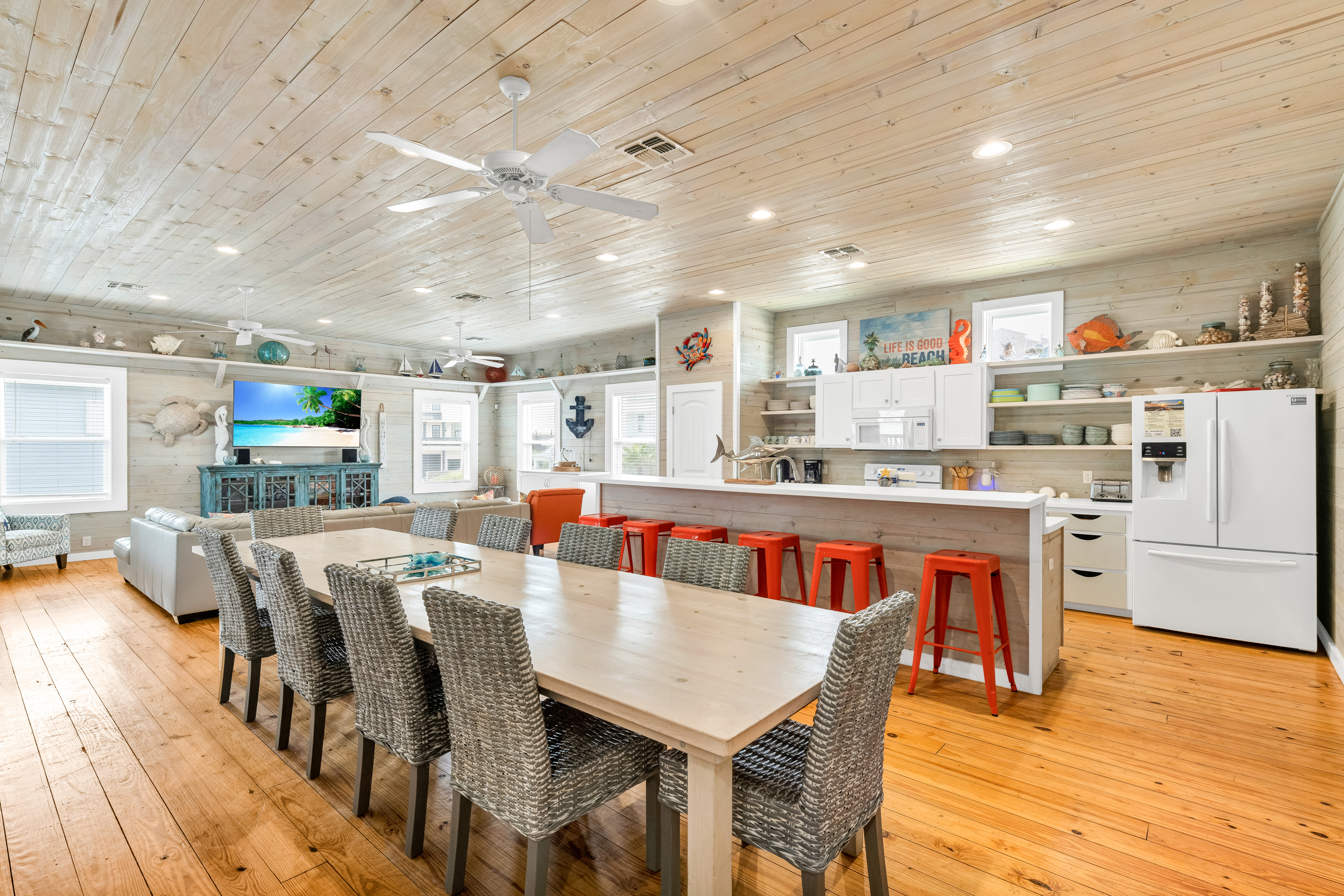 Gather ‘round and dig in at this spacious dining table that seats 10 with 6 more at the kitchen island