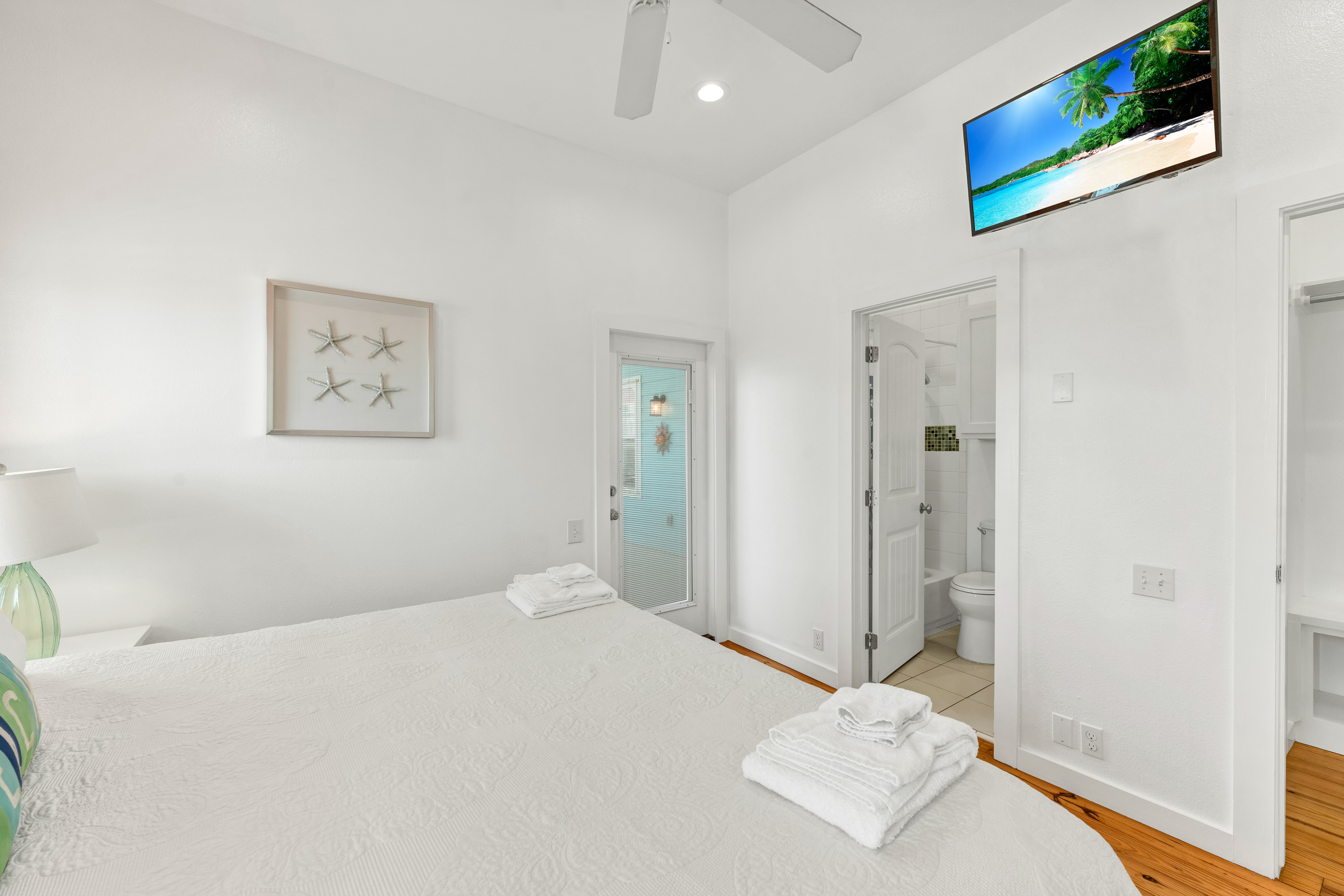 Your Quiet Corner of Luxury featuring a king size bed, flatscreen tv and patio access